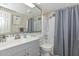 Well-lit bathroom with a tub-shower combo, modern fixtures, and stylish countertop at 8930 W Sells Dr, Phoenix, AZ 85037
