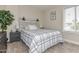 Stylish bedroom with a modern bed frame, contemporary decor, and natural lighting at 8930 W Sells Dr, Phoenix, AZ 85037