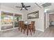 Dining area with wood table, outdoor patio view, and sliding glass door access at 8930 W Sells Dr, Phoenix, AZ 85037