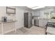 Efficient kitchen featuring stainless steel appliances, granite countertops, and ample cabinet space at 8930 W Sells Dr, Phoenix, AZ 85037
