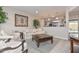 Inviting living room features an open floor plan and seamless transition into the kitchen at 8930 W Sells Dr, Phoenix, AZ 85037