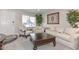 Bright living area with neutral walls, large window, and elegant furniture at 8930 W Sells Dr, Phoenix, AZ 85037