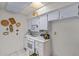 Bright kitchen featuring white appliances, tile flooring, and generous cabinet space at 10072 W Lancaster Dr, Sun City, AZ 85351