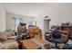 Living room with lots of boxes and furniture at 10072 W Lancaster Dr, Sun City, AZ 85351