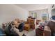 Living room with lots of boxes and furniture at 10072 W Lancaster Dr, Sun City, AZ 85351