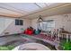View of covered patio with sliding glass door and outdoor seating area at 10072 W Lancaster Dr, Sun City, AZ 85351