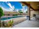 View of the pool and landscaped backyard from the covered patio at 10242 E Pantera Ave, Mesa, AZ 85212