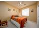 Cozy bedroom with a full bed, carpet flooring, and a window at 10242 E Pantera Ave, Mesa, AZ 85212