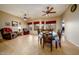 Spacious dining area with tile floors, natural light, and ceiling fan for a welcoming atmosphere at 10242 E Pantera Ave, Mesa, AZ 85212