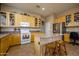 Spacious kitchen with an island, tile floors, and abundant cabinet space for storage at 10242 E Pantera Ave, Mesa, AZ 85212