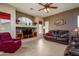 Cozy living area with neutral paint, tile floors, and ample space for relaxation and entertainment at 10242 E Pantera Ave, Mesa, AZ 85212