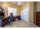 Home office with tile flooring, desk, shelving, and a closet at 10242 E Pantera Ave, Mesa, AZ 85212