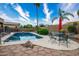 Inviting backyard pool area with ample seating and desert landscaping at 10242 E Pantera Ave, Mesa, AZ 85212