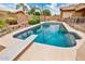 Sparkling pool with diving board and well-maintained deck area at 10242 E Pantera Ave, Mesa, AZ 85212