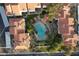 Aerial view of the complex highlighting the swimming pool and surrounding mature landscaping and red tile roofs at 10401 N 52Nd St # 210, Paradise Valley, AZ 85253