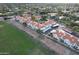 Aerial view of the complex showcasing a swimming pool, covered parking, mature trees and landscaping at 10401 N 52Nd St # 210, Paradise Valley, AZ 85253