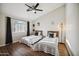 Bright bedroom featuring a vaulted ceiling, a large window, and hardwood floors creating a comfortable space at 10401 N 52Nd St # 210, Paradise Valley, AZ 85253
