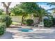 Private hot tub area surrounded by lush greenery, offering a tranquil space for relaxation and rejuvenation at 10401 N 52Nd St # 210, Paradise Valley, AZ 85253