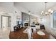 Spacious living and dining area featuring a fireplace, balcony access, and seamlessly connected to the kitchen at 10401 N 52Nd St # 210, Paradise Valley, AZ 85253