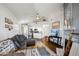 Bright, open living room with a cozy fireplace and stylish decor, flowing into an adjacent, modern kitchen at 10401 N 52Nd St # 210, Paradise Valley, AZ 85253