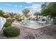 Community pool surrounded by lush landscaping, providing a refreshing oasis for relaxation and enjoyment at 10401 N 52Nd St # 210, Paradise Valley, AZ 85253