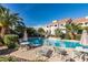 Stunning pool area with tropical landscaping, comfortable seating, and a serene atmosphere for relaxation at 10401 N 52Nd St # 210, Paradise Valley, AZ 85253
