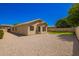 The backyard features a rock landscape with low maintenance and block fence at 1071 E Chelsea Dr, San Tan Valley, AZ 85140