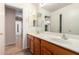 Bathroom with double sinks, a long vanity, and views to additional rooms at 1071 E Chelsea Dr, San Tan Valley, AZ 85140