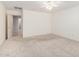 This spacious bedroom features neutral carpet, a ceiling fan, and ample natural light at 1071 E Chelsea Dr, San Tan Valley, AZ 85140