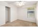 This bedroom features neutral walls, carpet, a closet, and natural light at 1071 E Chelsea Dr, San Tan Valley, AZ 85140