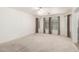 Large bedroom with carpet, natural light through multiple windows, and neutral wall color at 1071 E Chelsea Dr, San Tan Valley, AZ 85140
