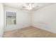Bright bedroom featuring neutral walls and carpet, and a large window at 1071 E Chelsea Dr, San Tan Valley, AZ 85140