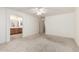 Spacious main bedroom with carpeting and en-suite bathroom with dual-sink vanity and tub at 1071 E Chelsea Dr, San Tan Valley, AZ 85140