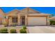 Charming single-story home featuring a tile roof, desert landscaping and a spacious two car garage at 1071 E Chelsea Dr, San Tan Valley, AZ 85140