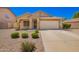 Charming single-story home featuring a tile roof, desert landscaping and a spacious two car garage at 1071 E Chelsea Dr, San Tan Valley, AZ 85140