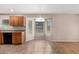 Bright kitchen nook with corner windows, wood cabinets, and breakfast bar area for casual dining at 1071 E Chelsea Dr, San Tan Valley, AZ 85140