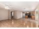 Open-concept living room flows into the kitchen with wood floors and neutral tones, creating a welcoming space at 1071 E Chelsea Dr, San Tan Valley, AZ 85140