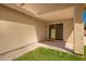 A covered patio with a sliding glass door, extending living space outdoors at 1071 E Chelsea Dr, San Tan Valley, AZ 85140