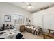 Bright bedroom with white walls, two twin beds and a ceiling fan at 10869 E Hedgehog Pl, Scottsdale, AZ 85262