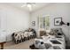 Bright bedroom with white walls, two twin beds and a ceiling fan at 10869 E Hedgehog Pl, Scottsdale, AZ 85262