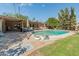A picturesque backyard featuring a sparkling pool, patio, and ample space for outdoor recreation and relaxation at 11051 N 45Th Pl, Phoenix, AZ 85028