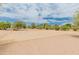 Outdoor basketball court features a sandy surface, mature landscaping, and comfortable shade at 11051 N 45Th Pl, Phoenix, AZ 85028