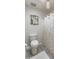 A bright bathroom offers a decorative shower curtain, toilet, and neutral walls at 11051 N 45Th Pl, Phoenix, AZ 85028