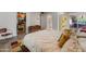 Spacious bedroom boasts a closet, access to the patio, and wood laminate flooring throughout at 11051 N 45Th Pl, Phoenix, AZ 85028