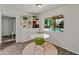 Eat-in kitchen offers a view of the pool, and built-in shelving, creating an inviting space at 11051 N 45Th Pl, Phoenix, AZ 85028
