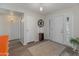 Bright foyer features wood floors and a white front door at 11051 N 45Th Pl, Phoenix, AZ 85028