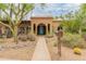 Charming single-story home featuring a tile roof, quaint landscaping and a bright blue front door at 11051 N 45Th Pl, Phoenix, AZ 85028