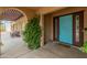 Covered front porch with light-blue front door and desert landscaping at 11051 N 45Th Pl, Phoenix, AZ 85028