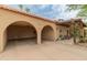 Exterior garage with tile roof and patio with pergola covering at 11051 N 45Th Pl, Phoenix, AZ 85028