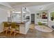 Open kitchen featuring a breakfast bar, white cabinetry, and modern appliances at 11051 N 45Th Pl, Phoenix, AZ 85028